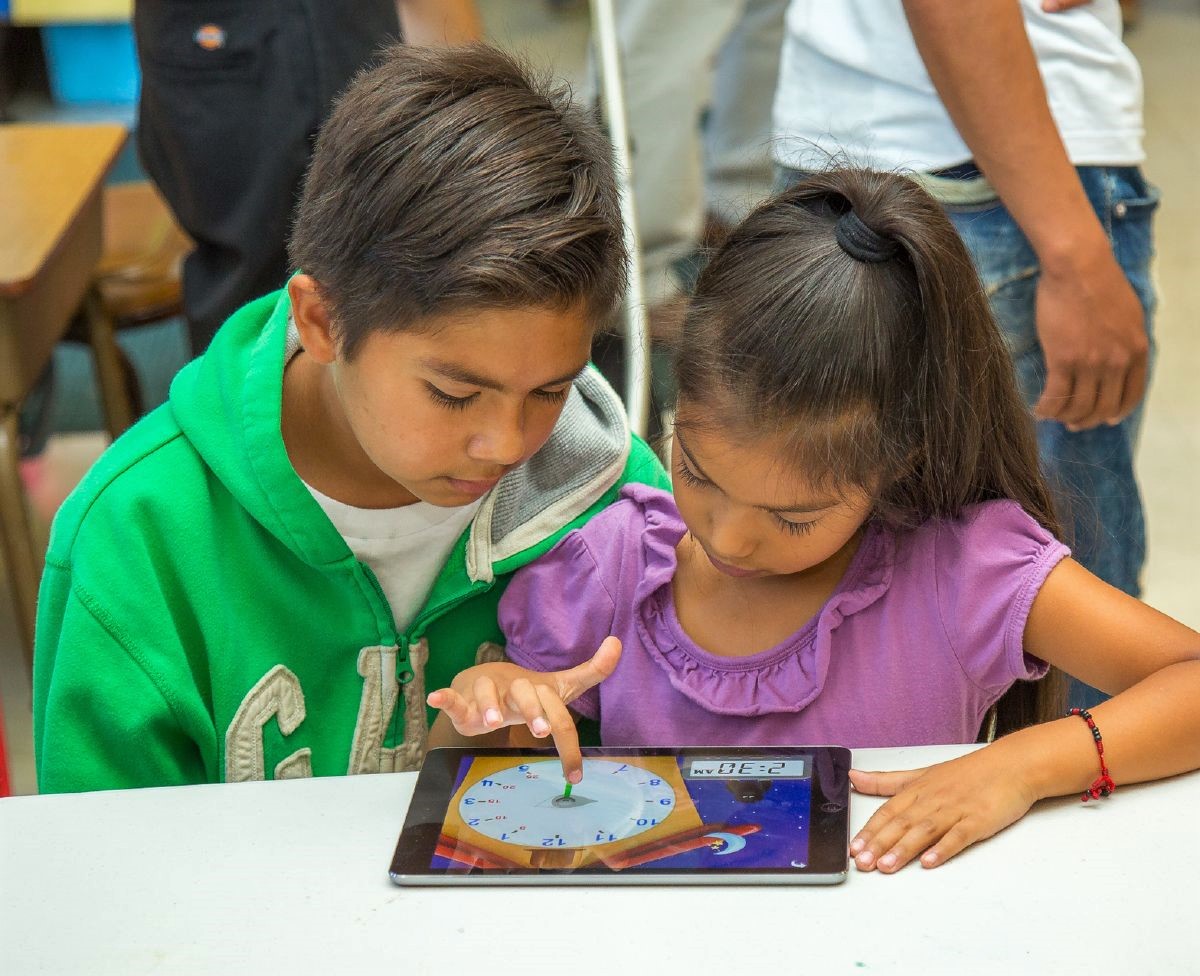 Two siblings working together at a Sunday Friends event